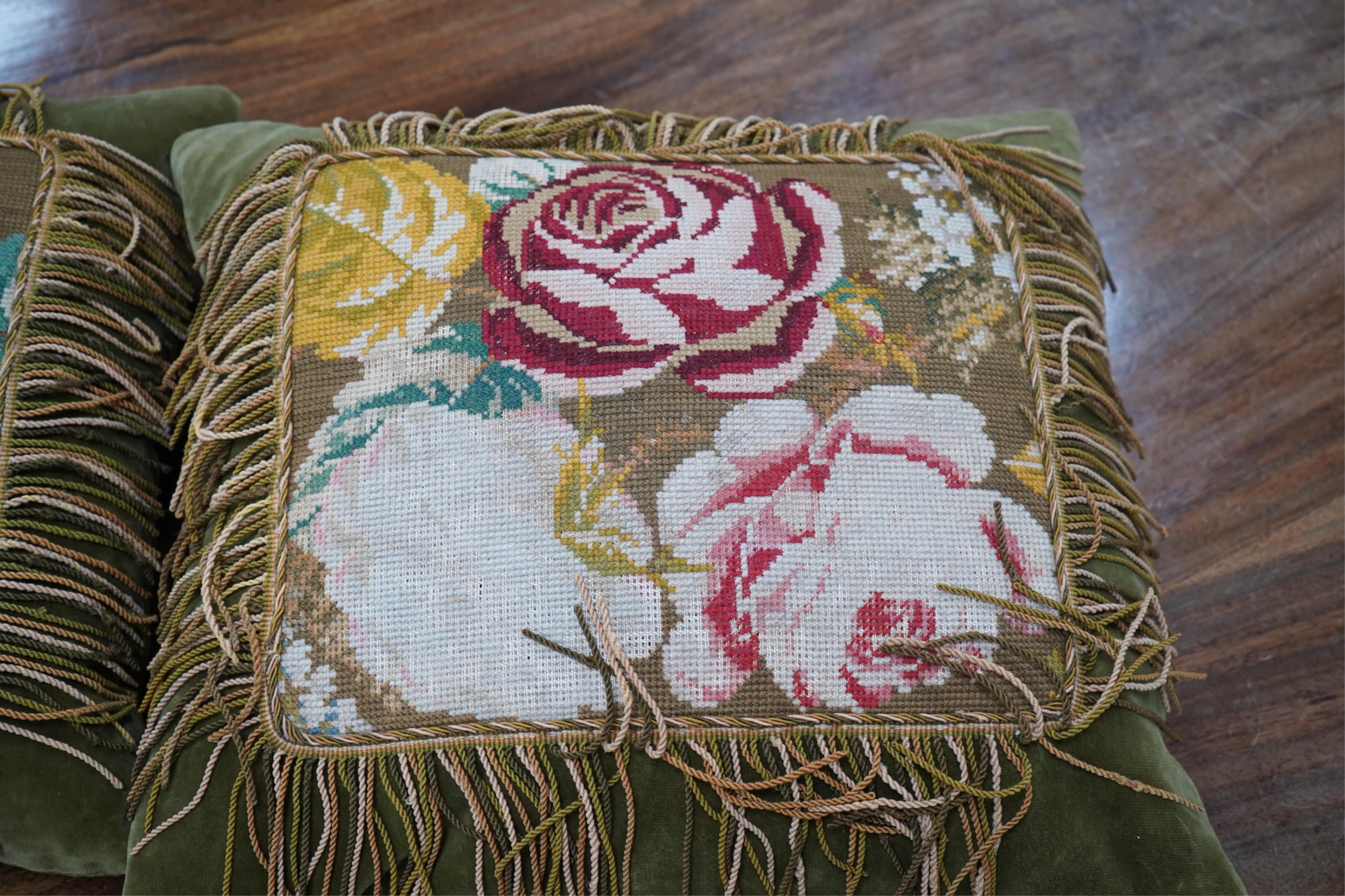 Seven 19th century cushions. Three Aubusson tapestry cushions and two machine Aubusson cushions, together with two floral wool worked cushions, all with decorative fringing. Largest 40cm x 45cm. condition - three are wor